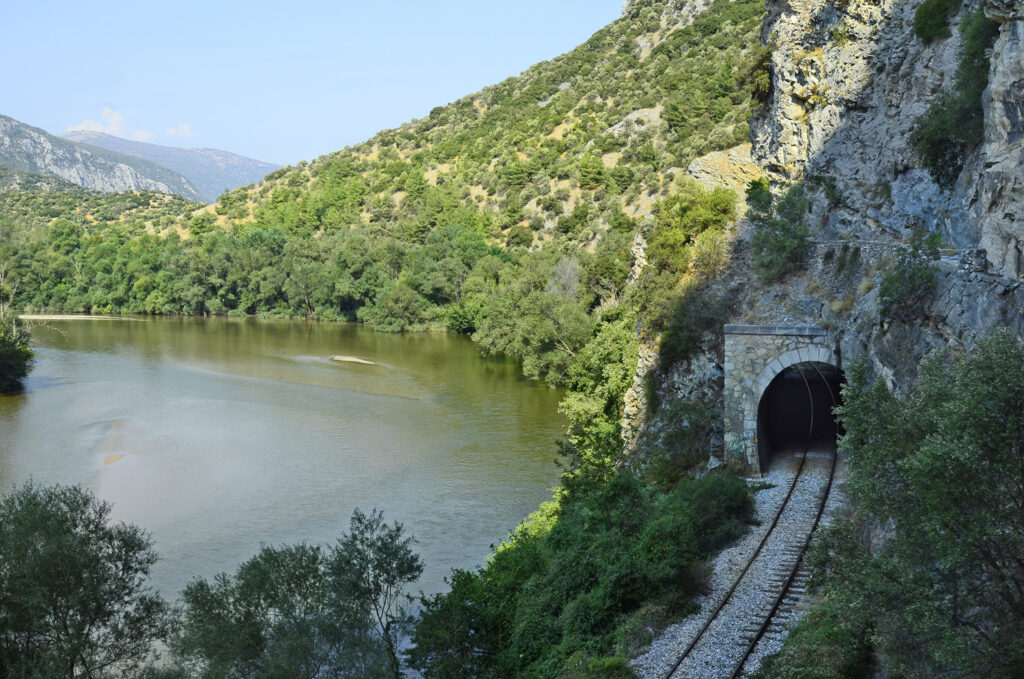 Greece, tunnel and rails from Drama-Xanthi railway and walking path along Nestos river