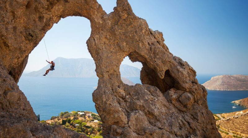 Rock climber at the "Palace", one of the most impressive rock formations in Kalymnos, Dodecanese, Greece