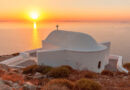 Sunset above small white church in Sikinos island, Greece