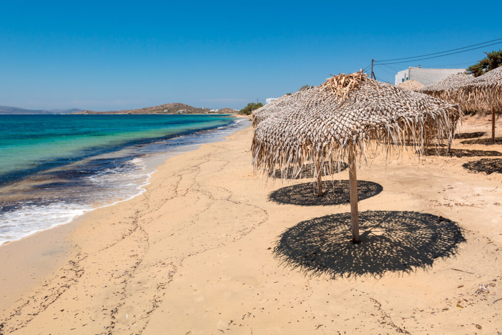 Umbrellas on the beautiful sandy beach of Agia Anna, Naxos island. Greece