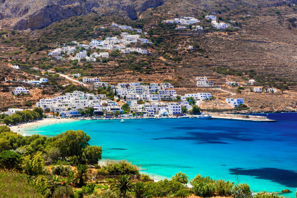 Traditional village white houses and turquoise sea Amorgos island, Cyclades Greece