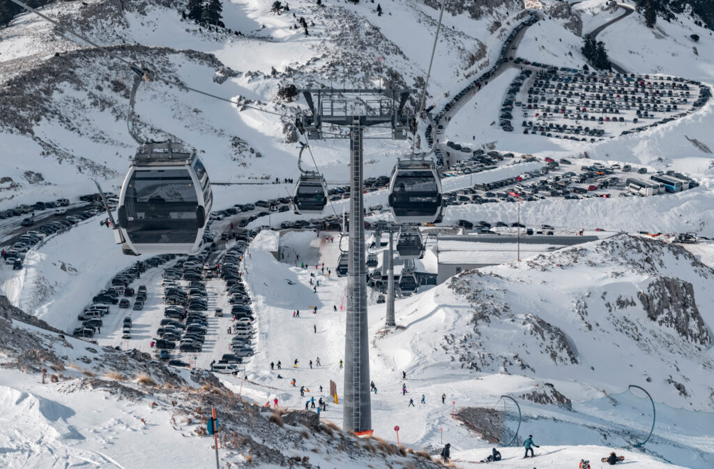 The-famous-mountain-of-Parnassos-with-popular-ski-resort-covered-up-in-snow-and-unique-nature-cable-cabins-car-parking-Voiotia-Greece